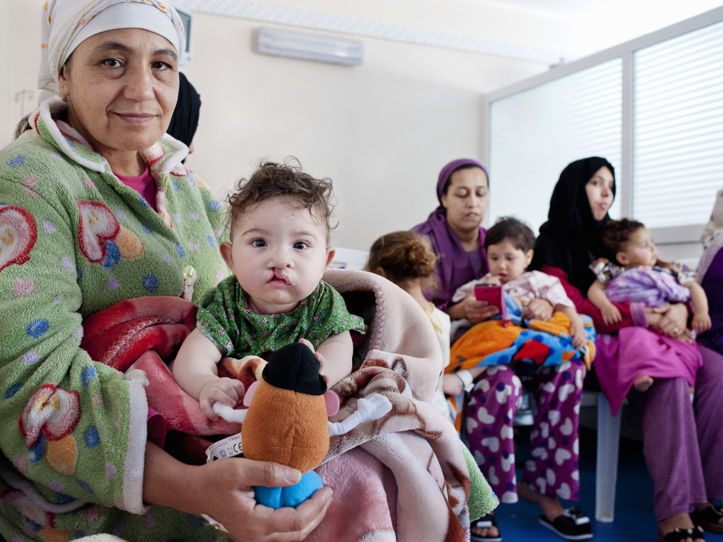 Rania arrives with her grandmother, Nour, ready for cleft surgery.
