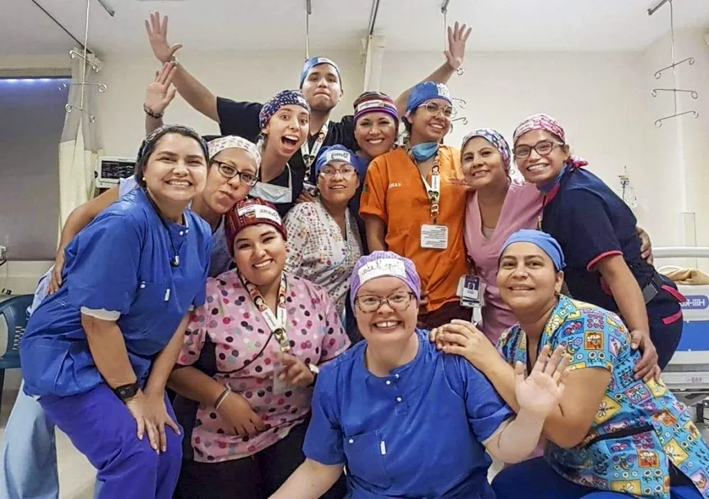 A group of volunteers smiles for the camera.