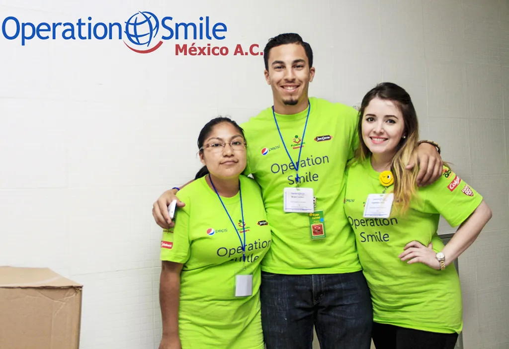 A group of volunteers smiles for the camera.
