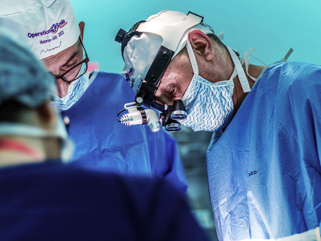 A doctor works during a program in Palestine.