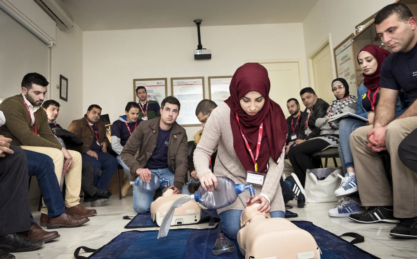 A health care provider shares information about CPR during a training.