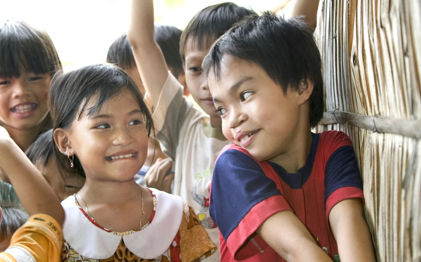 To kids share a moment during a surgical program.