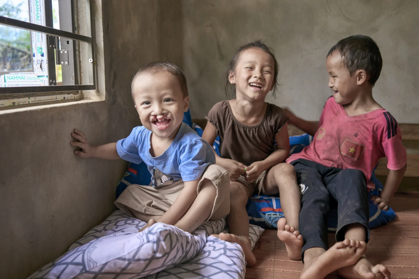 Phuc and his siblings share a laugh.