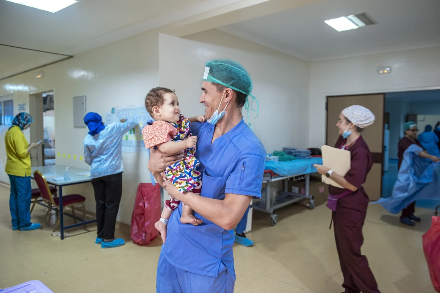 Dr. Paredes holds a patient at a program in Agadir.