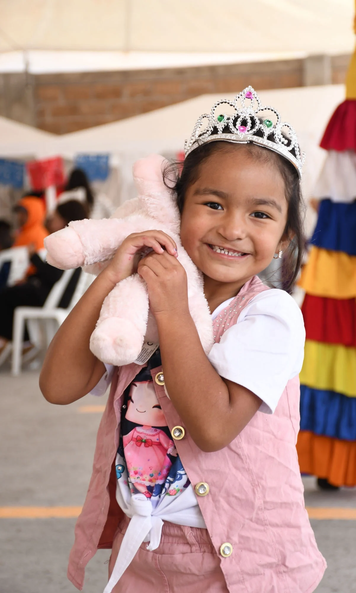 Li smiles for the camera while holding her stuffed bunny.