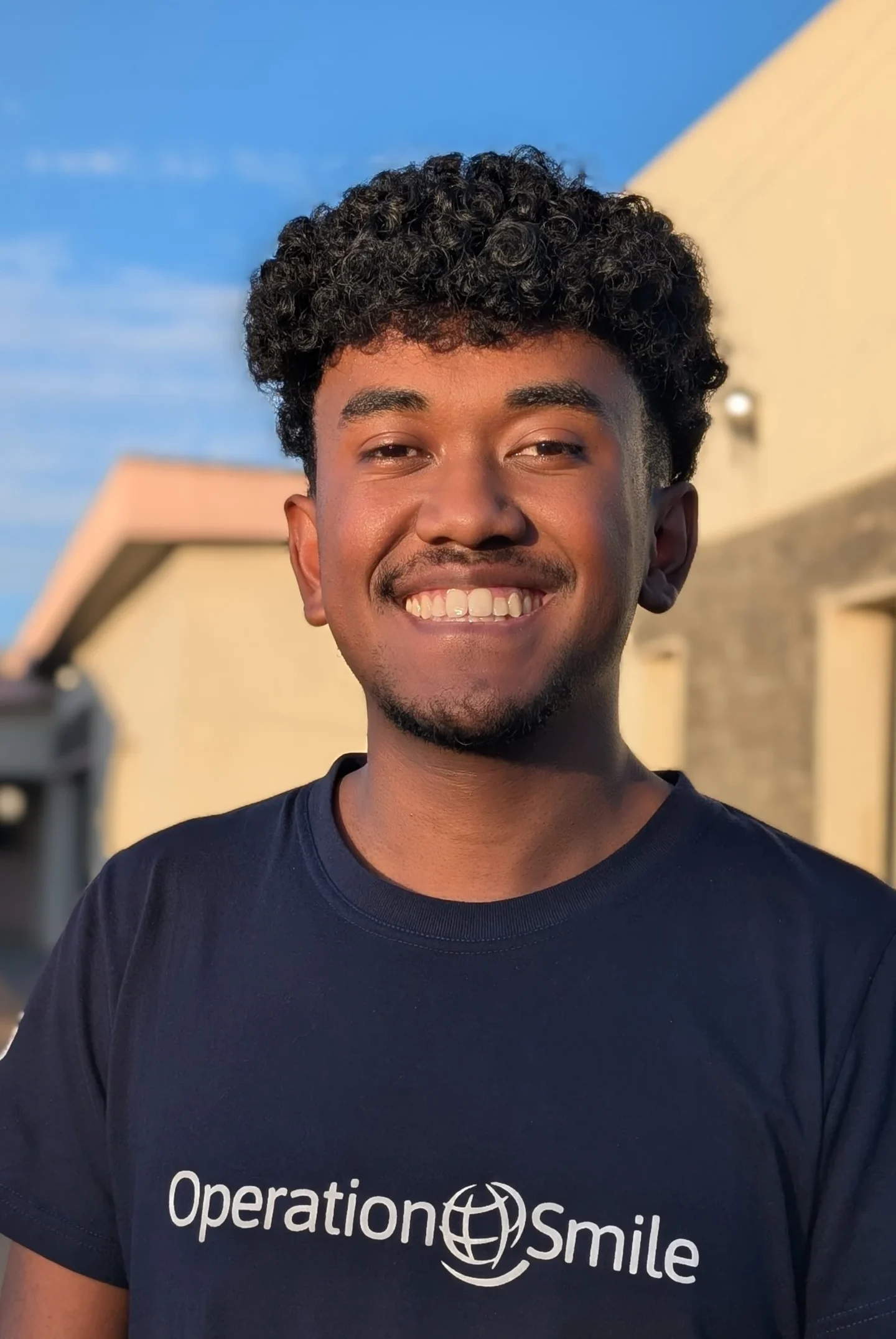 Aina smiles for the camera.