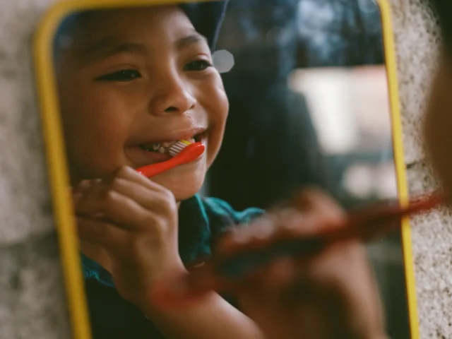 Junior Jeremias brushes his teeth.