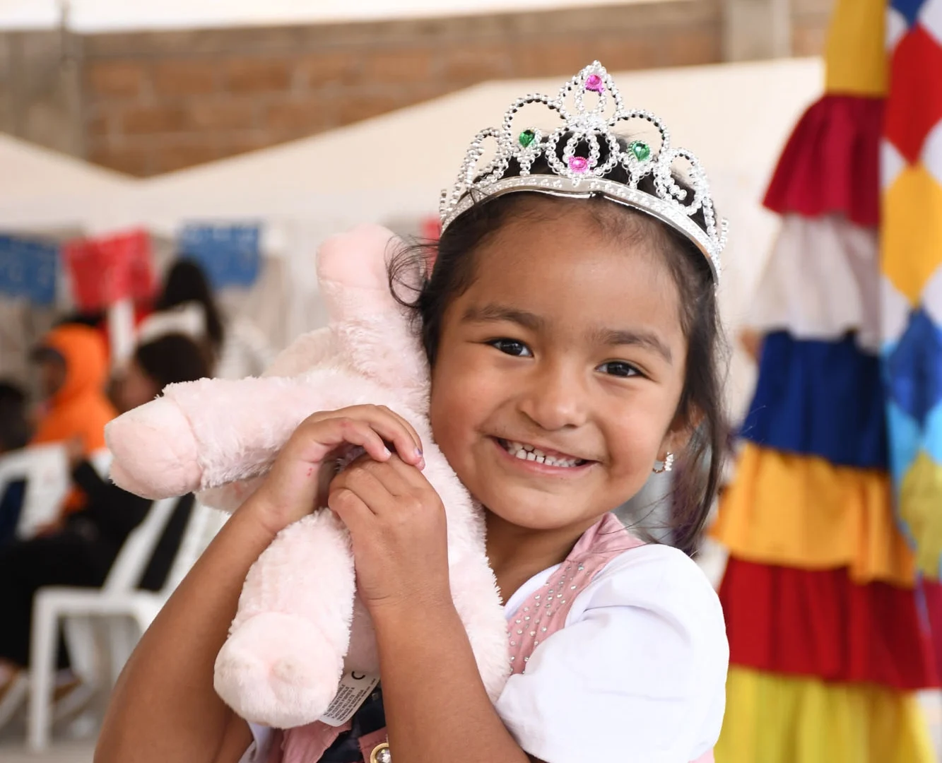 Li smiles for the camera while holding her stuffed bunny.