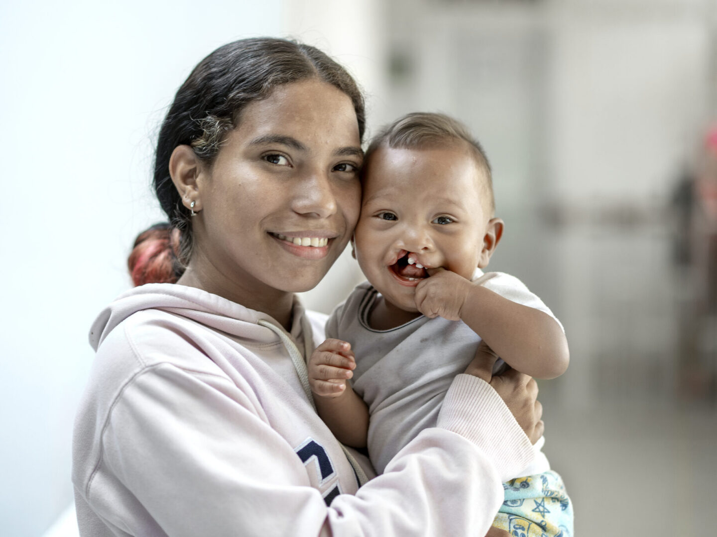 Ihan smiles for the camera with his mother, Carla.