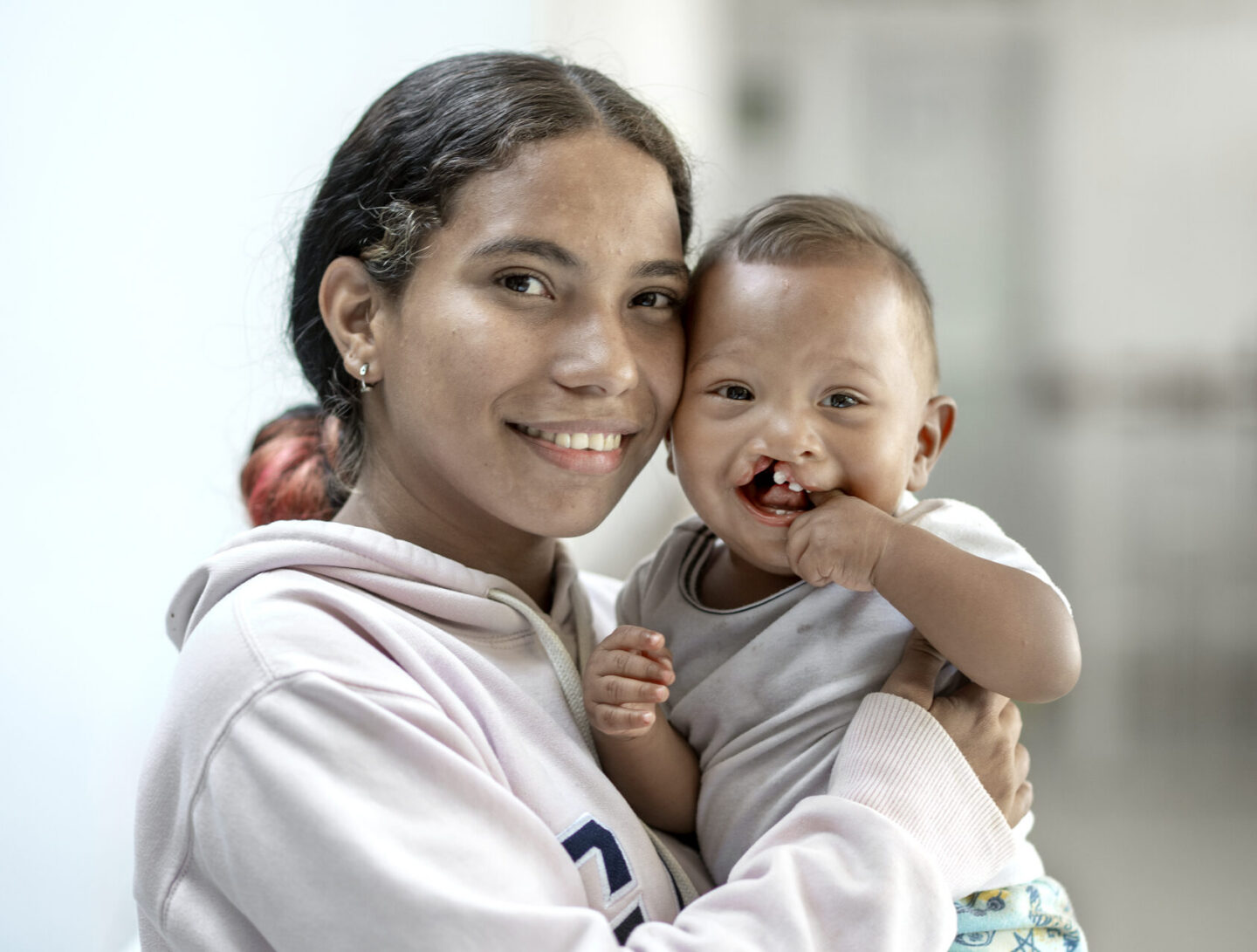 Ihan smiles for the camera with his mother, Carla.