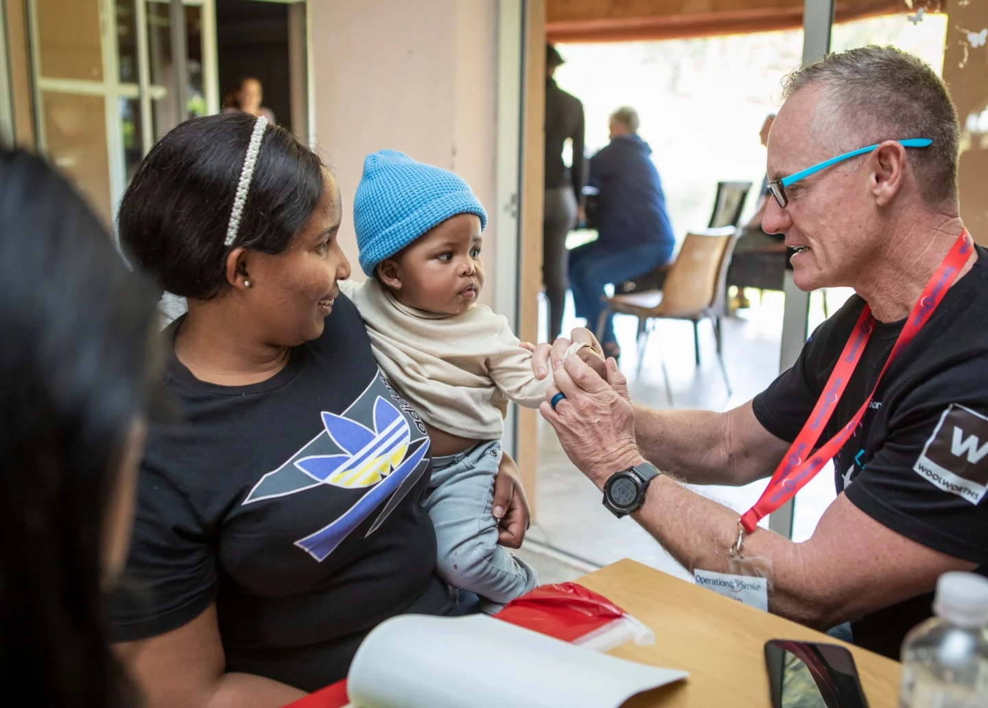 A healthcare provider examines a patient.