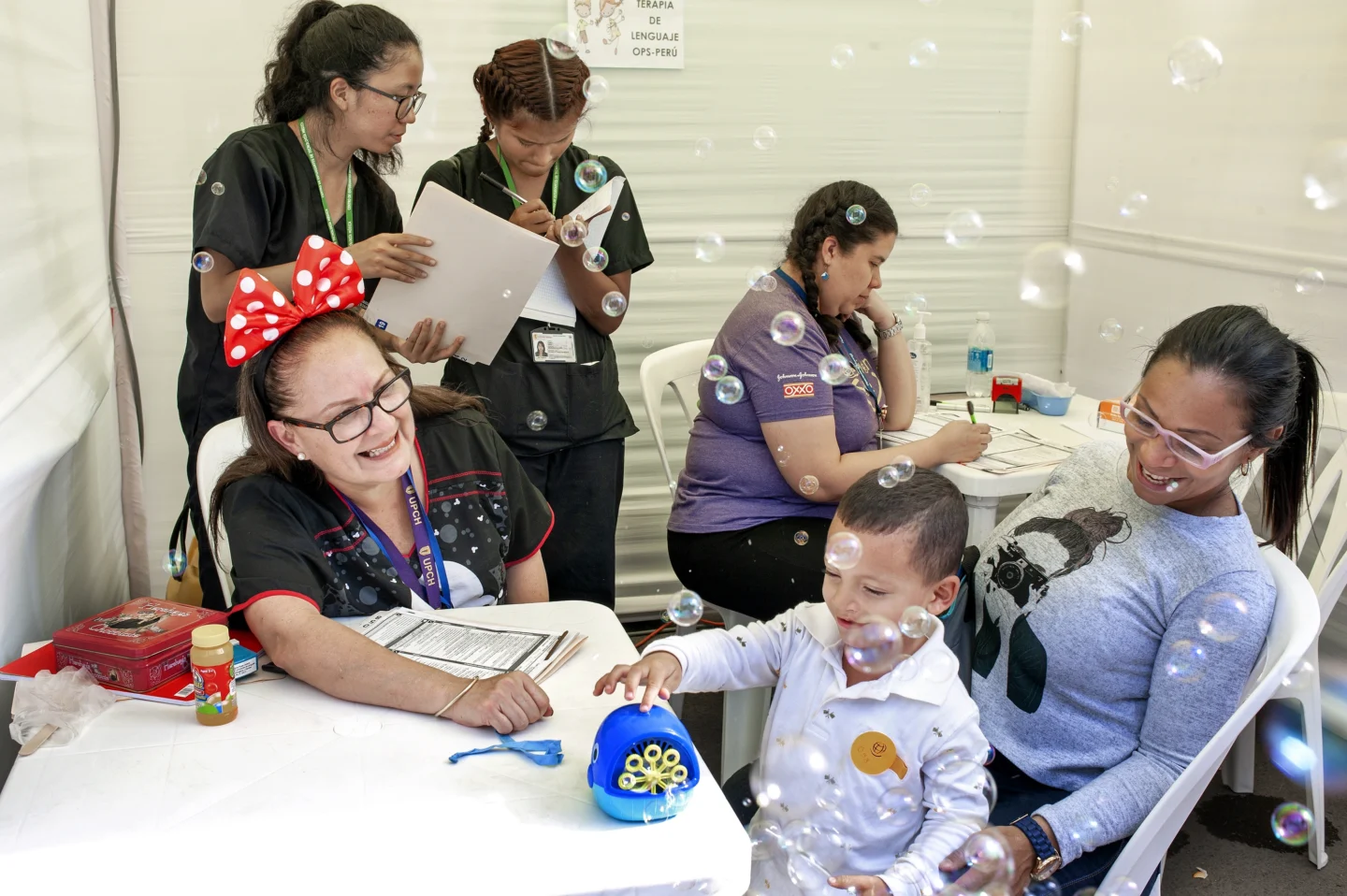 Speech therapist Milagros Rojas works with a patient.