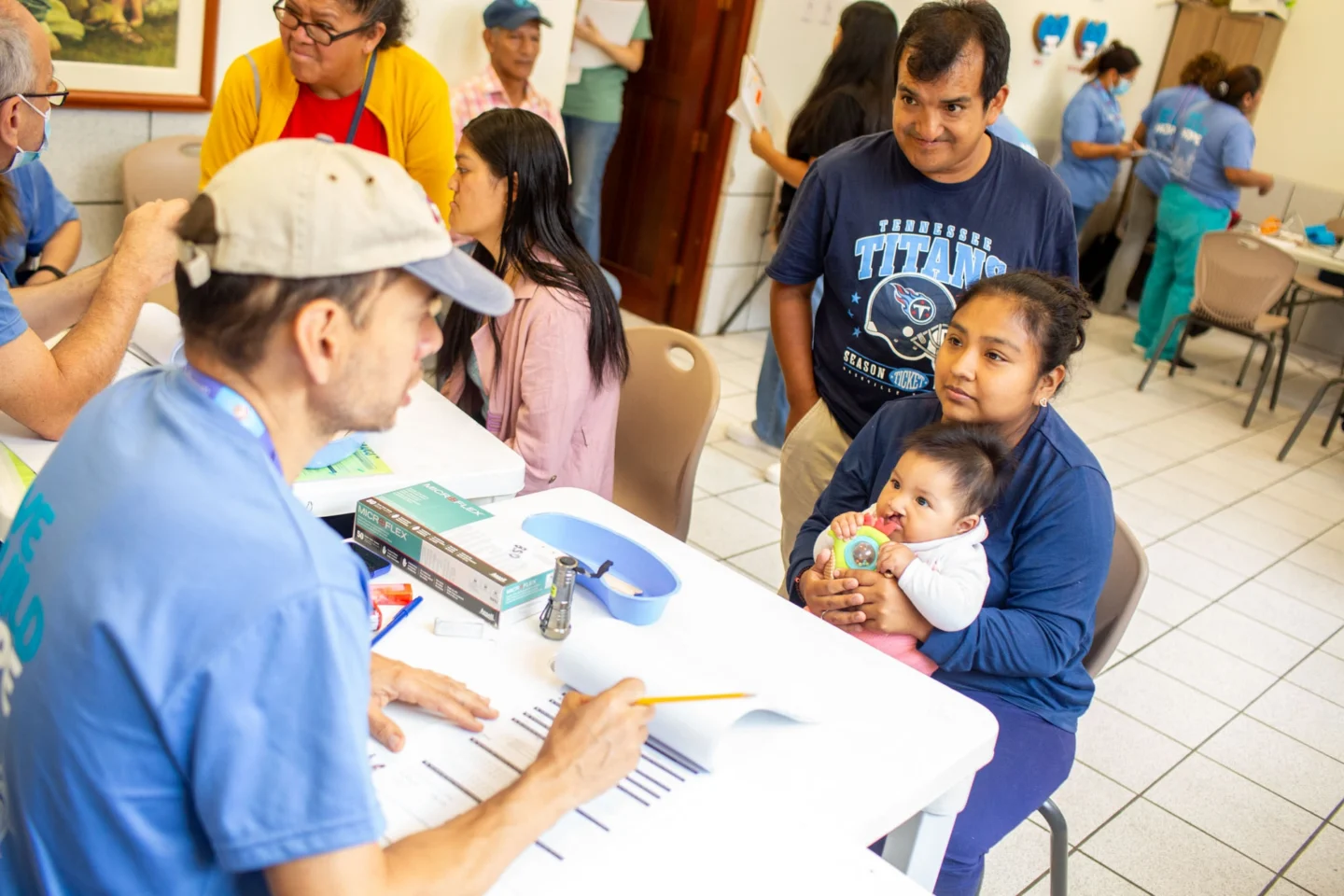 Margaret and her family speaks with a volunteer.