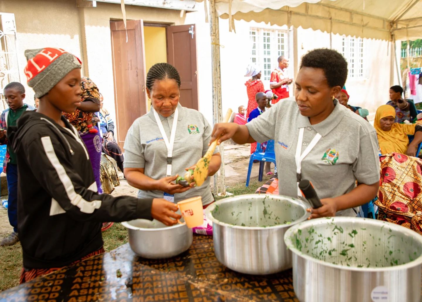 Volunteers at a program serve food.