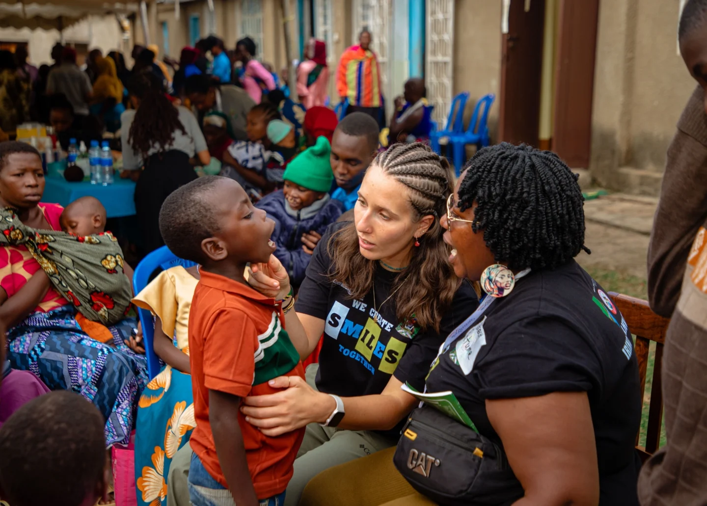 Volunteers examine a patient during a program.