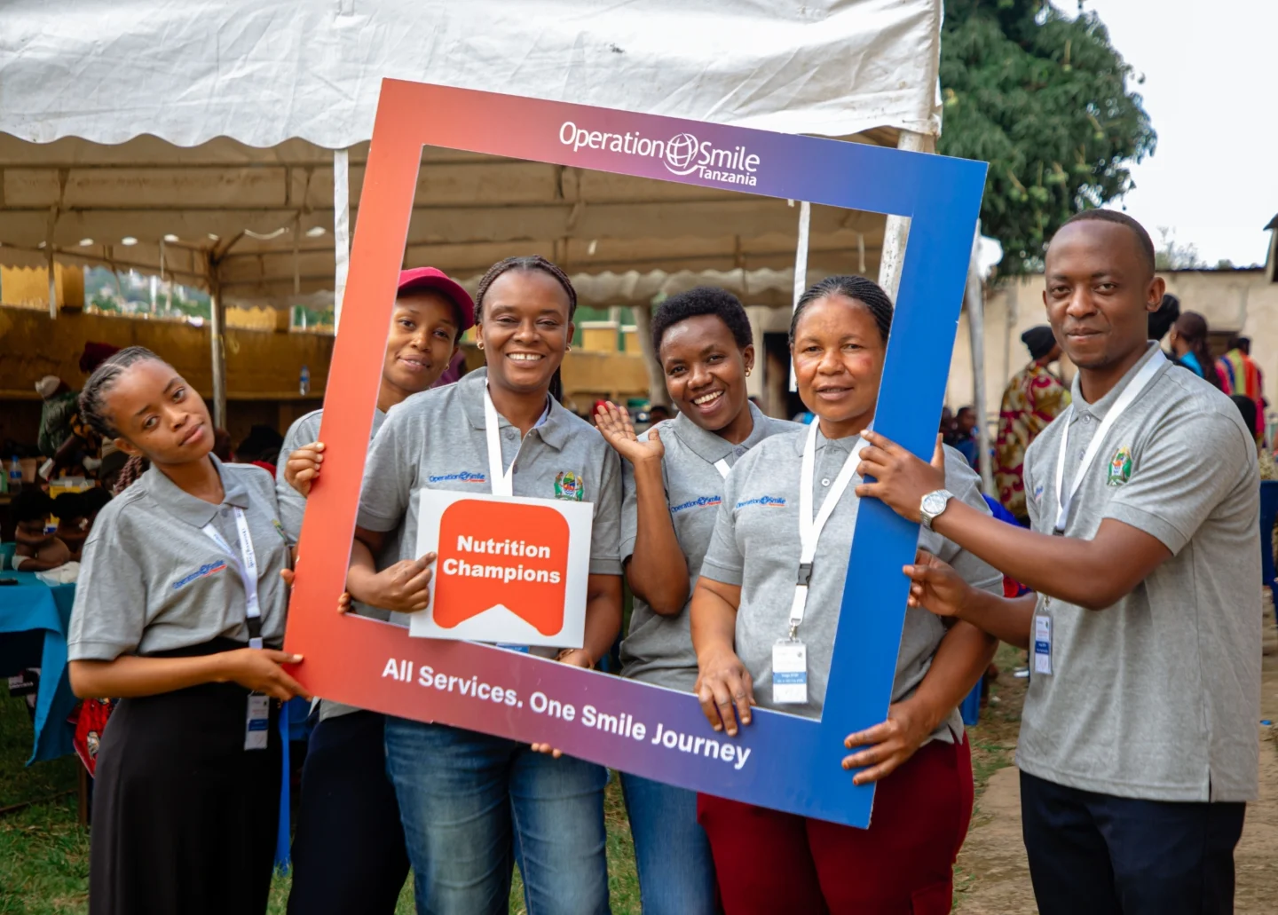Volunteers smile for a photo.