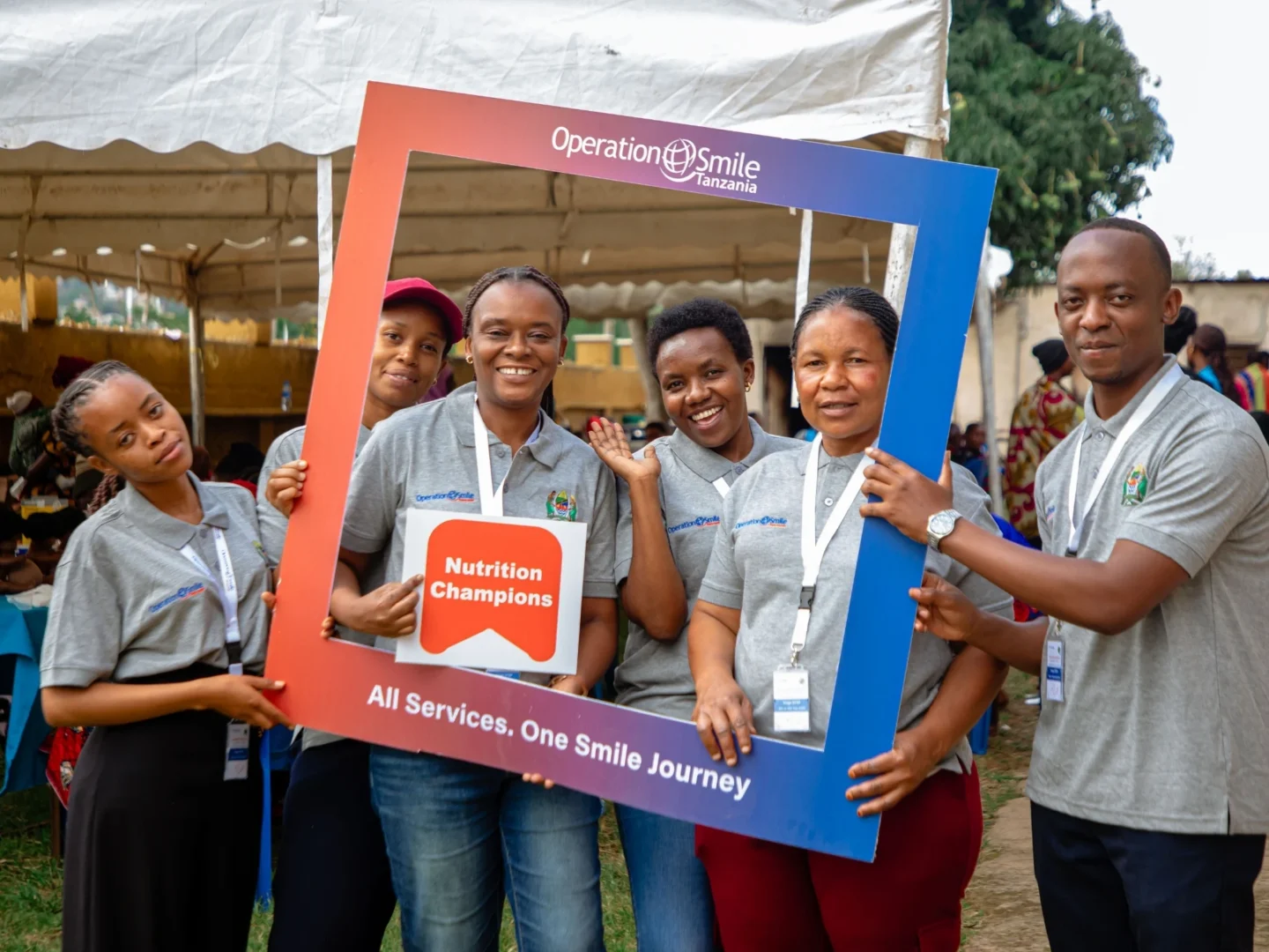 Volunteers smile for a photo.