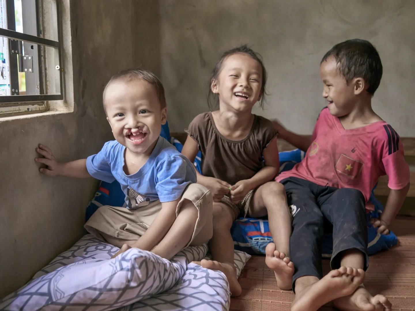 Phuc and his siblings share a laugh.